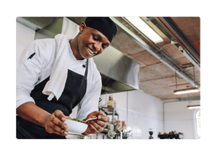 Chef preparing a dish in a professional kitchen