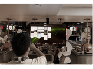 Restaurant kitchen with the Annoncer Kitchen Management System in use