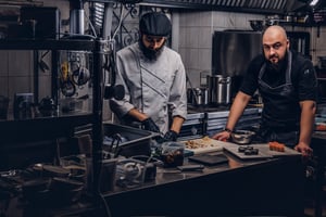 Chefs working together during busy restaurant service